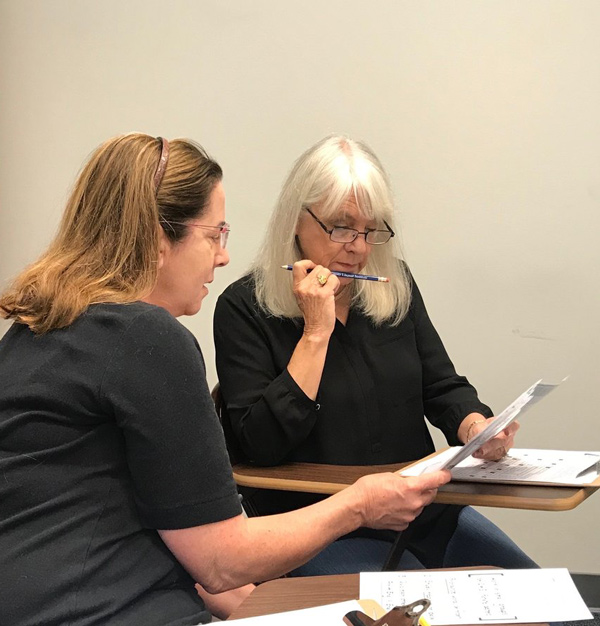 Private language learning lessons Spanish instructor working one-on-one with a private lesson student